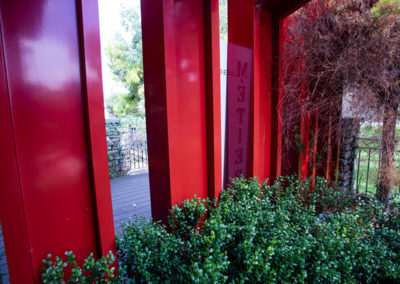 A red frame in the garden expertly crafted using sheet metal fabrication