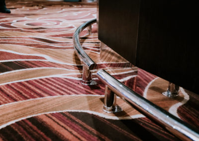 A sheet metal extruded rail on a carpet